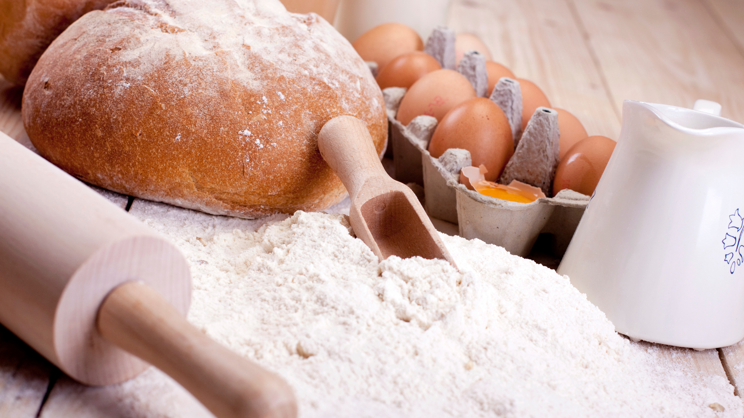 flour, eggs, and rolling pin to make bread